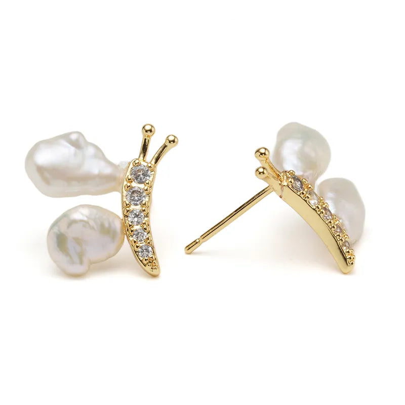 Elegant Baroque Pearl Stud Earrings with Gold Sculptural Butterfly