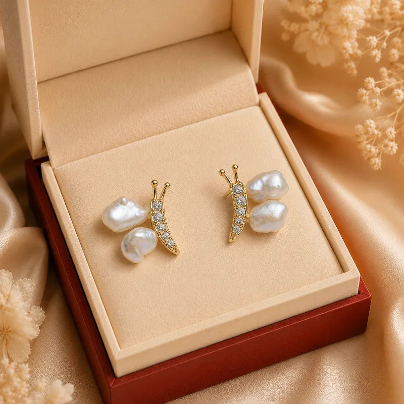 Elegant Baroque Pearl Stud Earrings with Gold Sculptural Butterfly